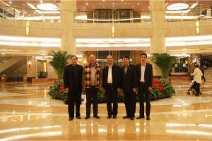 Wu Xiaojun (center), Governor of the Qinghai Provincial People's Government，and Chairman Fu Jianzhong (first from right) pose for a photo.